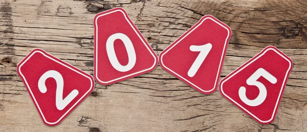 Números 2015 sobre fondo de madera marrón viejo —  Fotos de Stock
