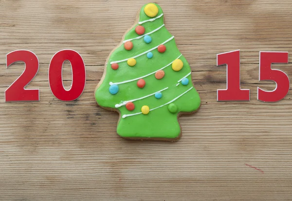 Vánoční 2015 cookie na dřevěný stůl — Stock fotografie