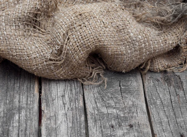 Jute patroon op houten tafel achtergrond — Stockfoto