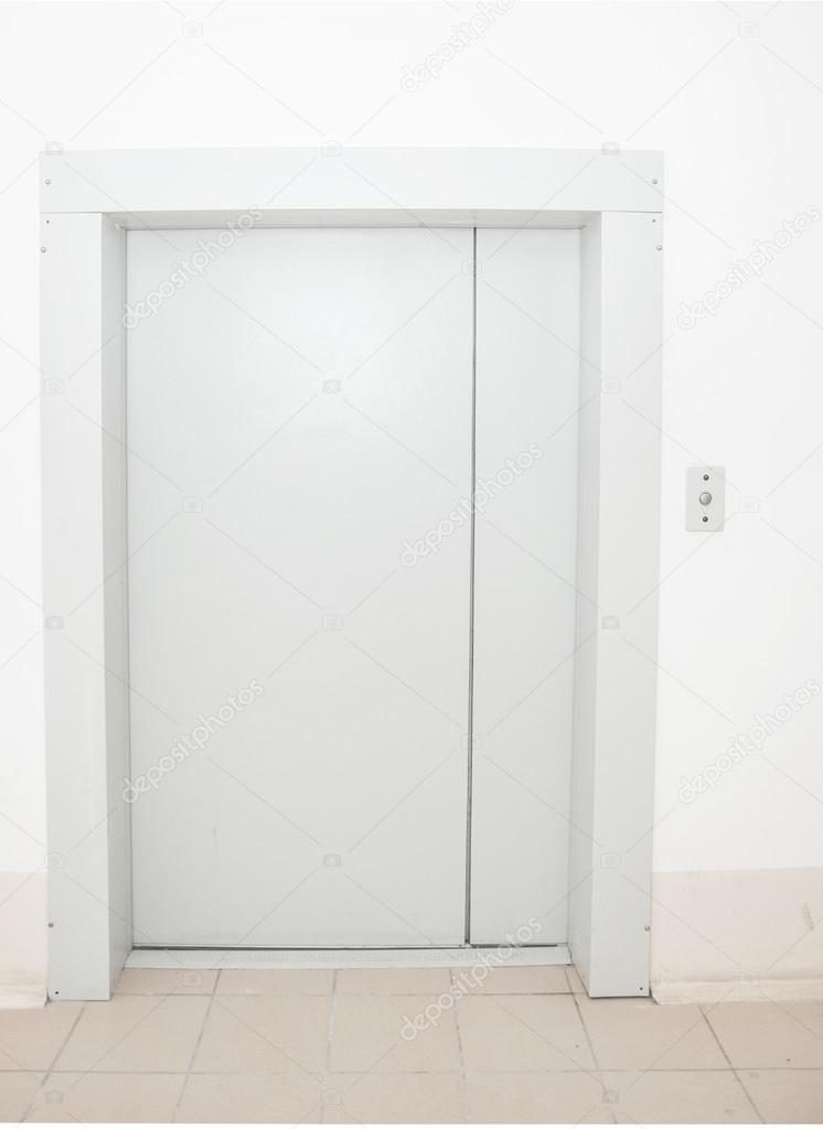 Front view of a modern elevator with closed doors