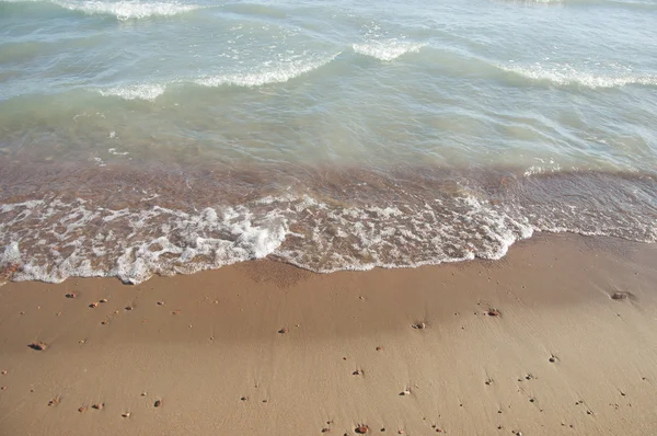 Κύμα και άμμο παραλία φόντο — Φωτογραφία Αρχείου
