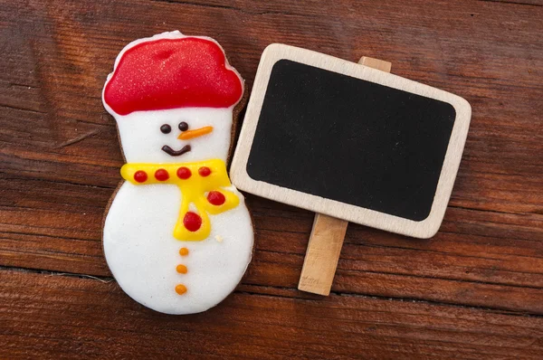 Weihnachtsplätzchen auf dem hölzernen Hintergrund — Stockfoto