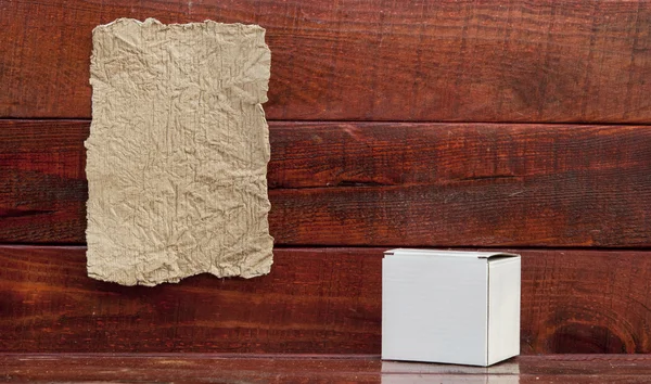 Paper box on a wooden background — Stock Photo, Image