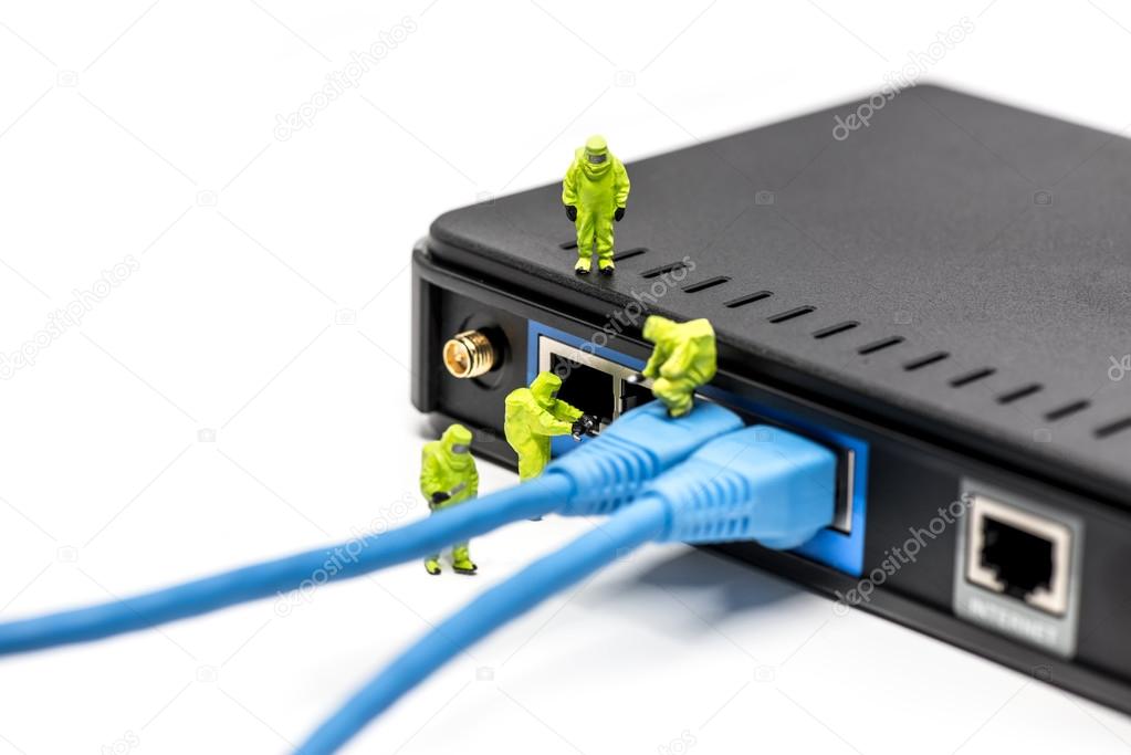 Network engineers connecting cables to the network switch.