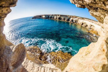 Sea caves near Cape Greko. Mediterranean Sea. Cyprus clipart