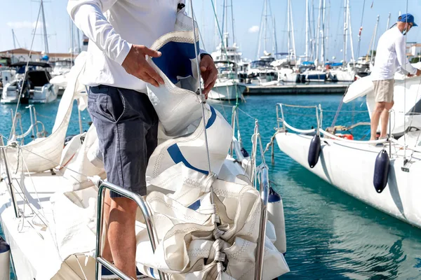 Yachtsman prepares the yacht for sailing away