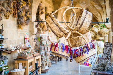 NICOSIA, CYPRUS - AUGUST 10, 2015: Straw basket souvenirs at Buyuk Han (The Great Inn).