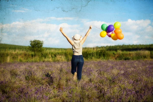 Giovane donna con palloncini colorati — Foto Stock