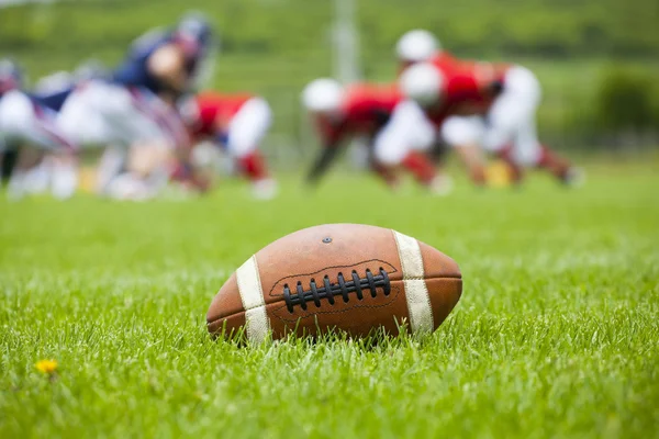 American football ball on the field — Stock Photo, Image