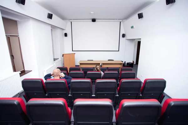 Cinema hall with empty screen. Concept of recreation and entertainment