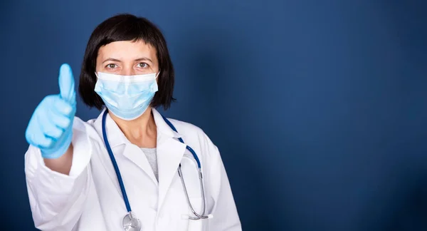 Smiling Female Doctor Stethoscope Wearing Medical Mask Showing Sign Isolated — Stok fotoğraf