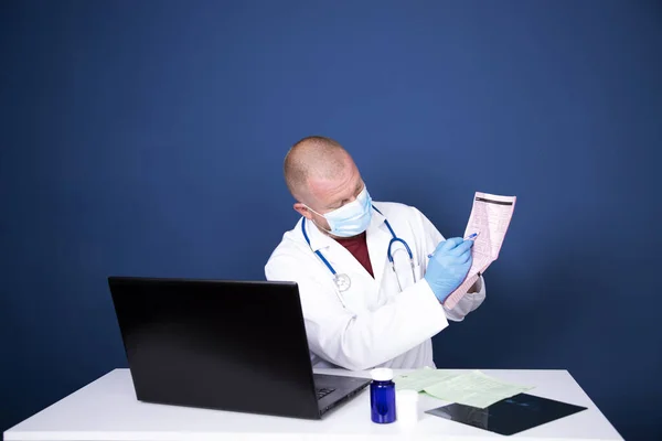 Male doctor consulting patient by online video call on laptop. Remote online medical chat consultation, tele medicine distance services, virtual physician conference call, telemedicine concept.