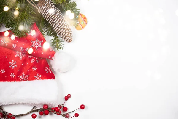 Christmas Background Gingerbread Cookies Santa Hat Pine Tree Branch White — Zdjęcie stockowe