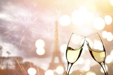 Champagne and Eiffel tower with fireworks, celebration of the New Year in Paris, France
