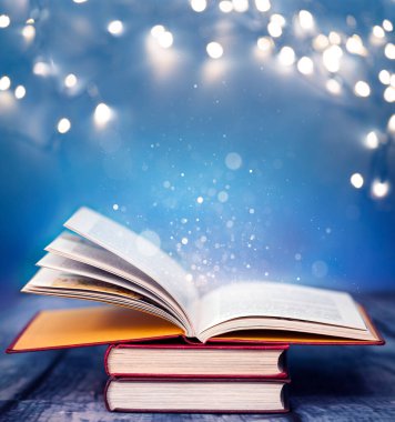 Sihirli ışıklar açık kitap. Bilgelik, din, okuma, hayal gücü, kavramı kış tatili