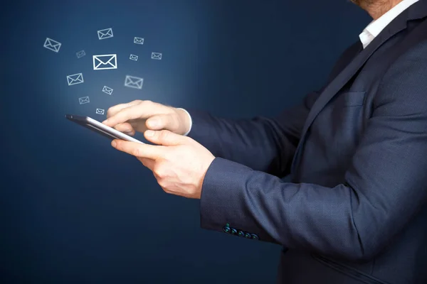 Businessman hand sending e-mails. Business economic technology working connect concept.