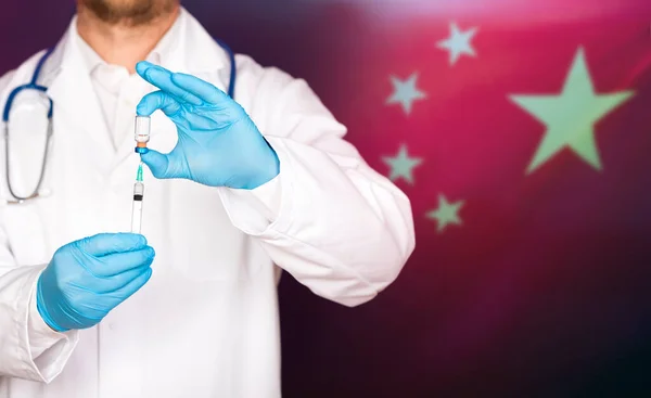 China flag with doctor preparing for vaccine. Mass vaccination against the epidemic of coronavirus in China concept.