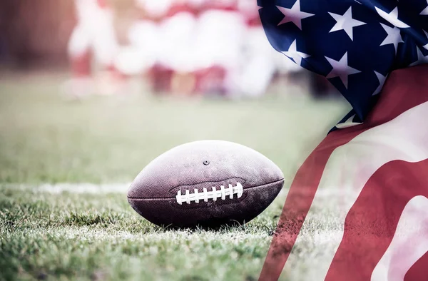 American football on stadium with USA flag