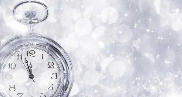 New Year's at midnight - Old clock and holiday lights — Stock Photo, Image