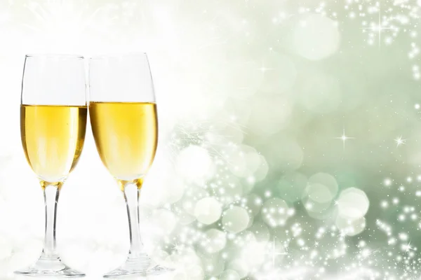 Glasses with champagne and clock close to midnight — Stock Photo, Image