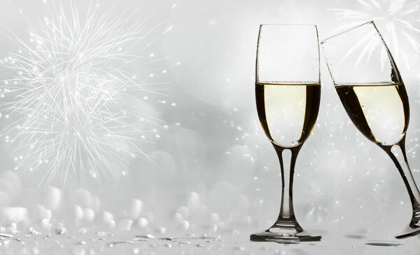 Champagne glasses against holiday lights