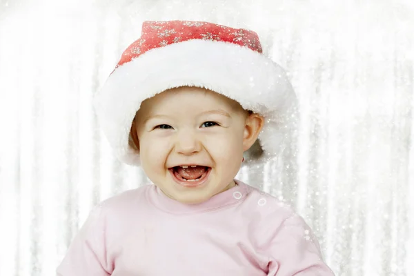 Cute baby girl in Santa hat — Stock Photo, Image