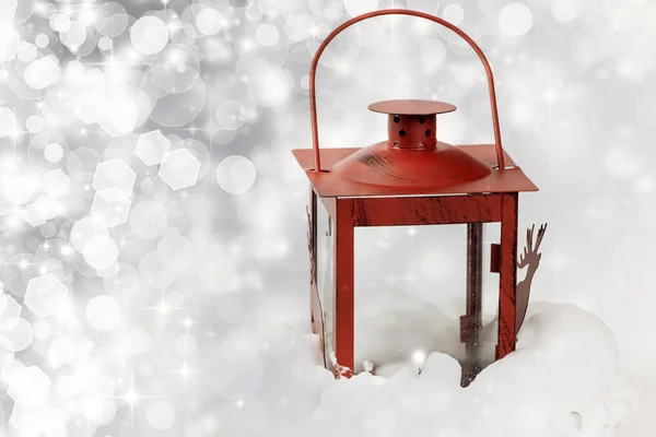 Christmas background with red lantern in snow — Stock Photo, Image