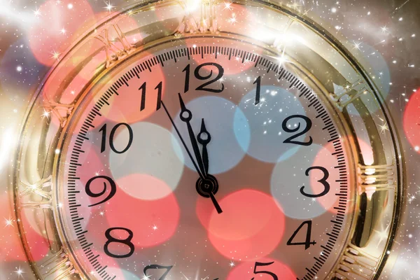 New Year's at midnight - Old clock and holiday lights — Stock Photo, Image