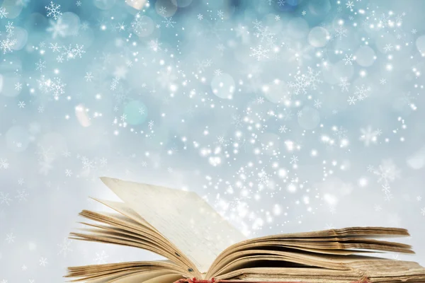 Kerstmis achtergrond met magische boek — Stockfoto