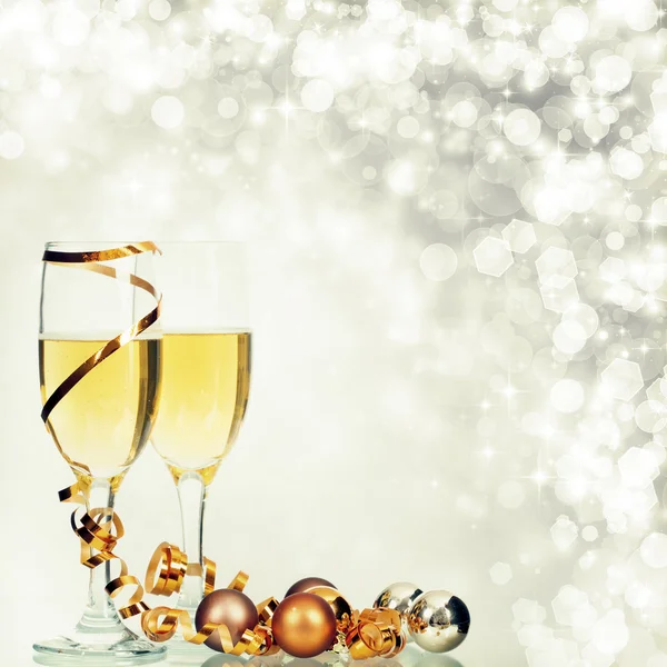 Glasses with champagne and Christmas decorations — Stock Photo, Image