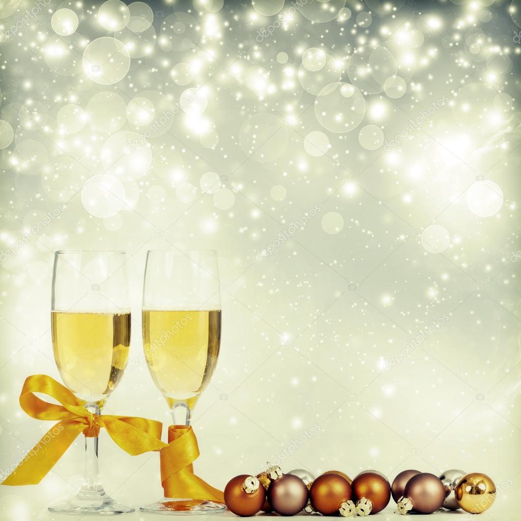 Glasses with champagne and Christmas decorations