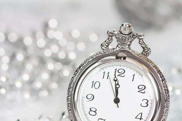 Old silver clock close to midnight and Christmas decorations — Stock Photo, Image