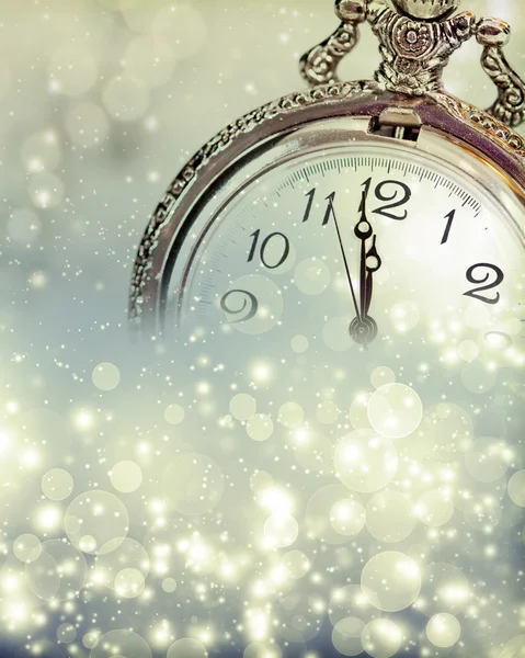 New Year's at midnight - Old clock and holiday lights — Stock Photo, Image