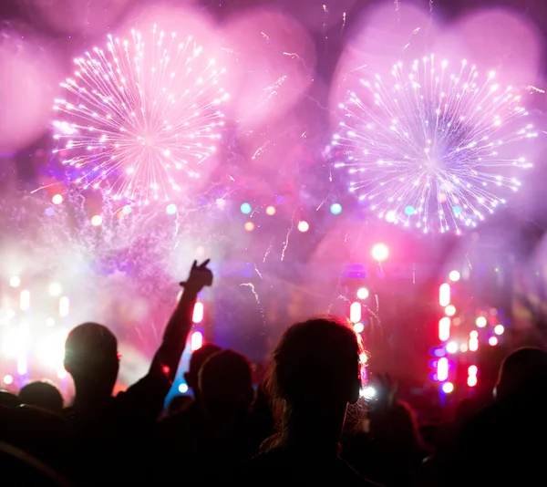 Fireworks and cheering crowd — Stock Photo, Image