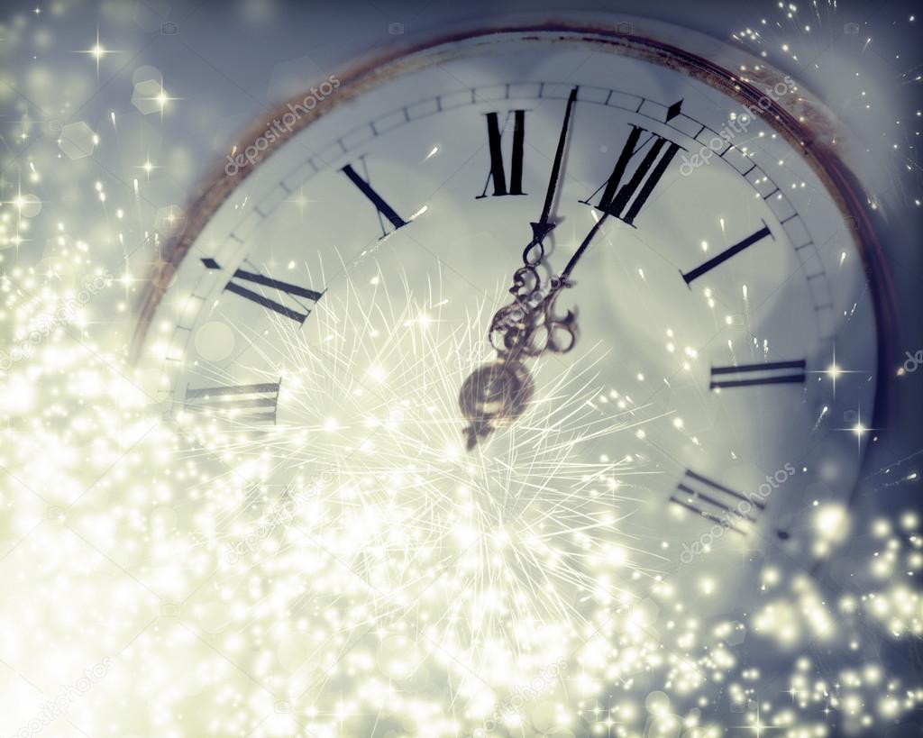 Old clock with fireworks