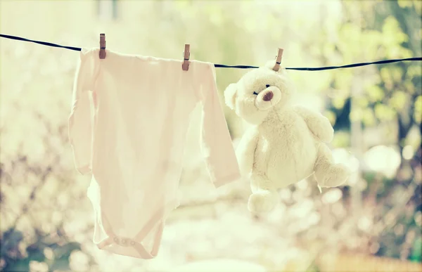 Baby clothes hanging on the clothesline — Stock Photo, Image