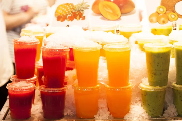 Fresh fruits juices exposed — Stock Photo, Image