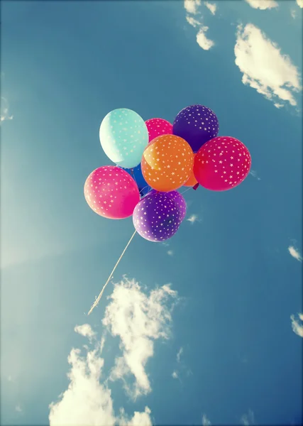 Colorful balloons flying on the blue sky — Stock Photo, Image