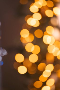 Blurred Christmas lights background with festive gold holiday bokeh