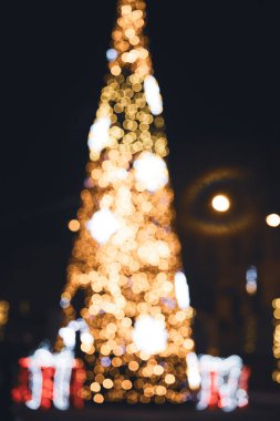 Defocused gold abstract Christmas tree outdoor