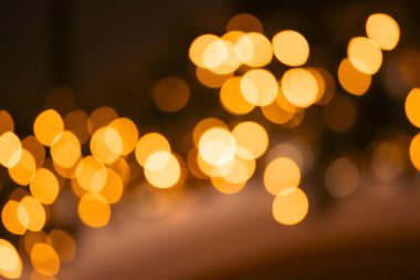Blurred Christmas lights background with festive gold holiday bokeh