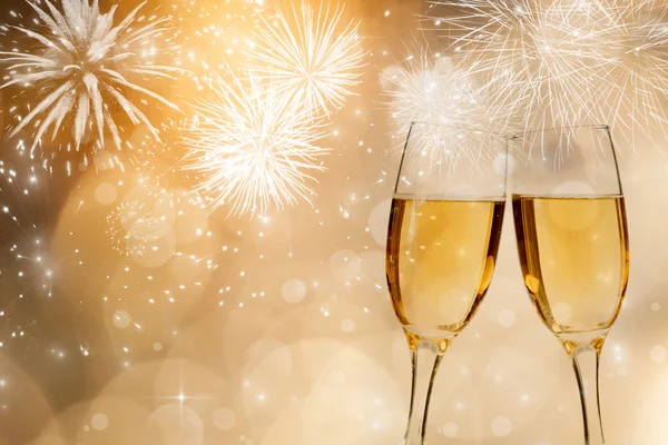 Champagne over fireworks and sparkling holiday lights — Stock Photo, Image