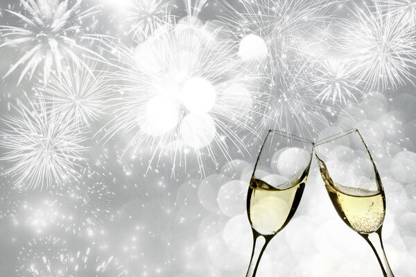Champagne over fireworks and sparkling holiday lights