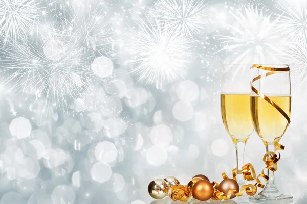 Celebrating New Year with champagne and fireworks — Stock Photo, Image