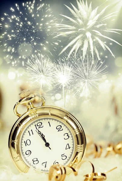 Old clock with fireworks and holiday lights — Stock Photo, Image