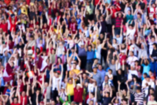 Blurred background of crowd of people at the stadium