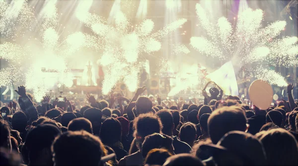 New Year concept - cheering crowd and fireworks — Stock Photo, Image