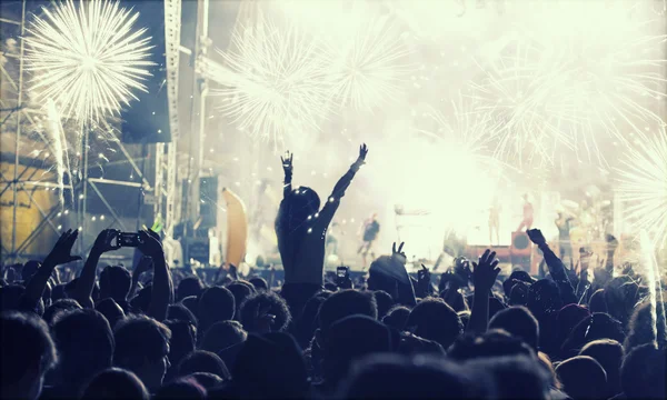 New Year concept - cheering crowd and fireworks — Stock Photo, Image