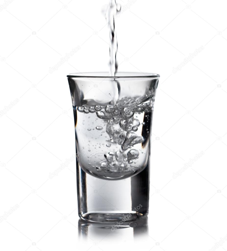 Vodka pouring into a glass