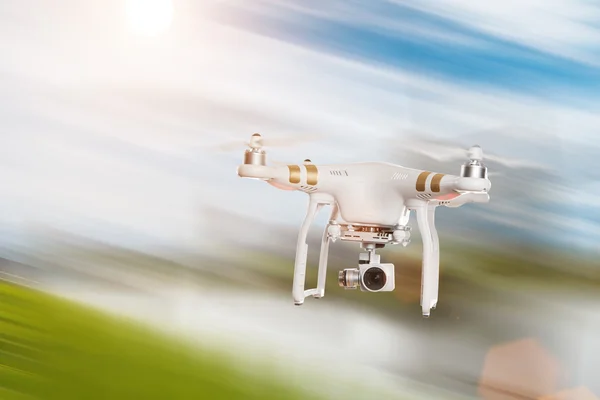 White drone quad copter with 4K digital camera flying. — Stock Photo, Image